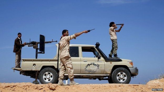 Libya Dawn fighters look at Islamic State (IS) militant positions near Sirte March 19, 2015.