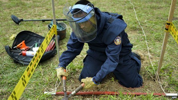 A Colombian soldier practices with a fake mine as part of his training before searching for real land mines, in Campo Alegre, Cocorna municipality, East of Antioquia department, Colombia on April 16, 2015