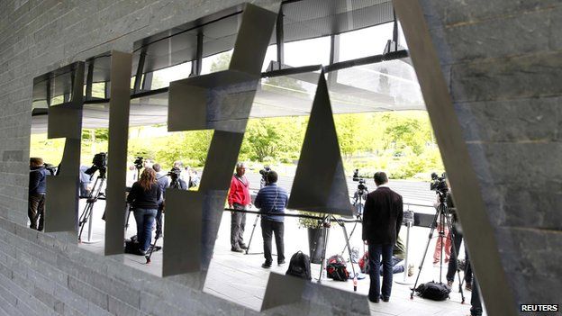 Members of the media stand in front of the FIFA headquarters in Zurich, on 30 May 2015