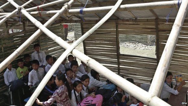 A school class in a temporary bamboo shelter in Bungmati, Nepal