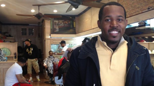 Irby in a barbershop