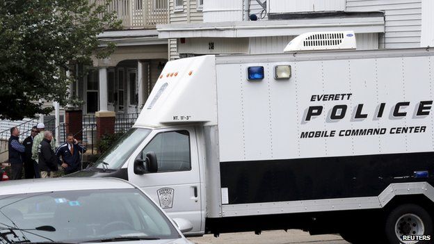 Police outside a raided home