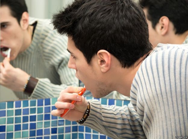 Man brushing teeth