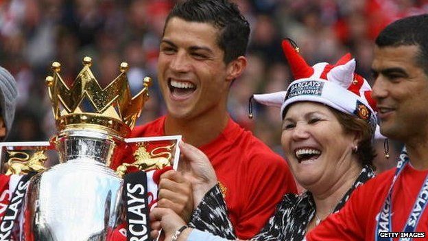 Cristiano Ronaldo of Manchester United celebrates winning the Barclays Premier League trophy with his mother in May 2009