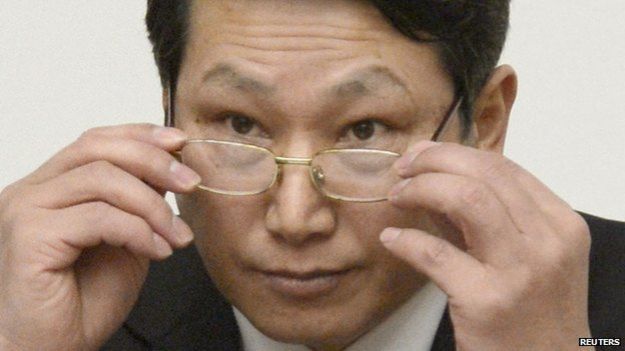 South Korean missionary, identified by the North as Kim Jong-uk, adjusts his glasses during a news conference in Pyongyang on 27 February 2014