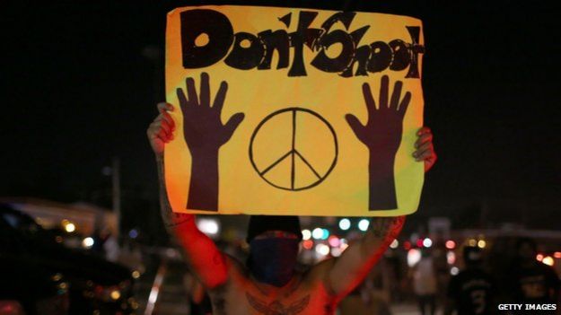 Protester in Ferguson holds up a 