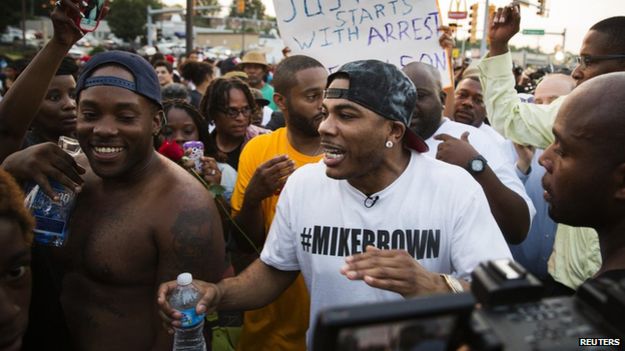 Nelly walking with protestors
