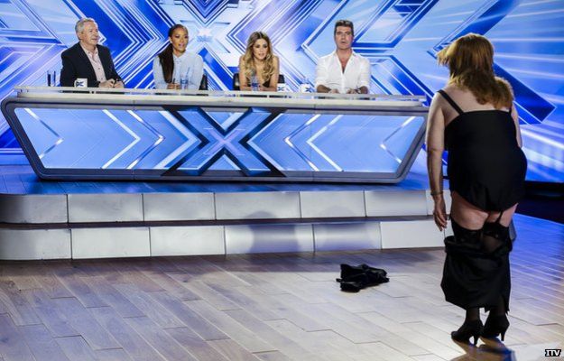 Woman stripping in front of X Factor judges