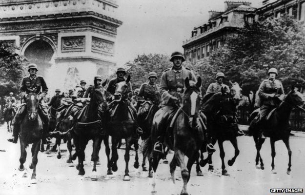 German troops ride through Occupied Paris
