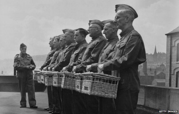 Members of the Home Guard with their racing pigeons in Blackburn, Lancashire in 1940. The pigeons were being trained as messengers.