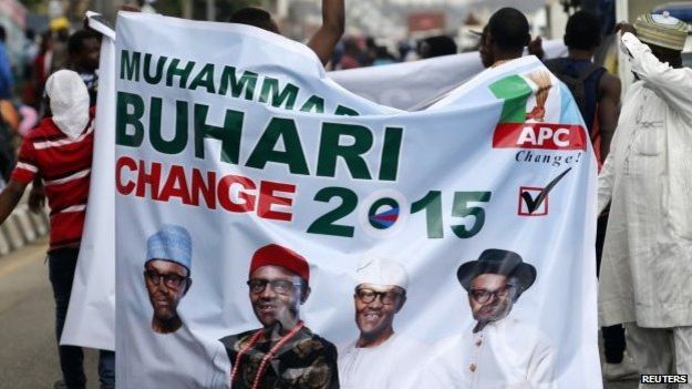 All Progressives Congress (APC) supporters hold a banner with a photograph of former military ruler Muhammadu Buhari before a convention to select a candidate to take on President Goodluck Jonathan, in Lagos, Nigeria - 10 December 2014