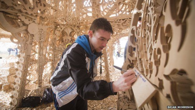 A young man leaves message inside the temple