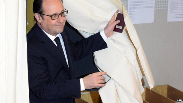 Francois Hollande leaves polling booth