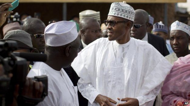 Gen Muhammadu Buhari arriving in his home town Daura, voting card in hand, 28 March 2015