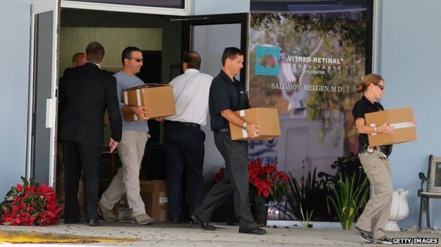 Law enforcement agents raid the office of Dr Salomon Melgen in West Palm Beach, Florida on 30 January 2013