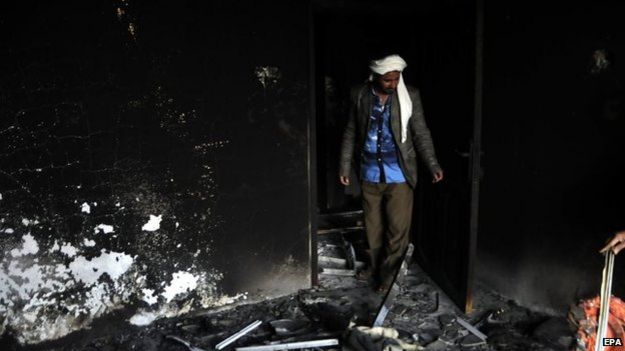 A Yemeni man inspects his house damaged by an airstrike allegedly carried out by a Saudi-led coalition against a Houthi rebels' position in the central city of Yarim, Yemen, 1 April 2015.