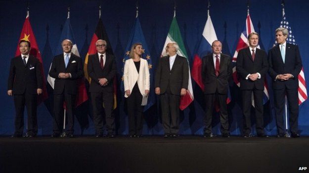 Representatives of the P5+1 - the US, UK, France, Russia, China and Germany - Iran and the EU stand together in Lausanne, Switzerland (2 April 2015)