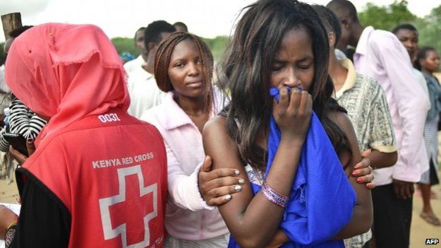 A female student being escorted off Garissa campus after the al-Shabab attack, 2 April 2015