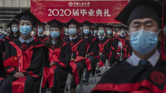 Chinese students from Renmin University of China are seated to adhere to social distancing during their graduation ceremony at the school's campus on June 30, 2020 in Beijing, China.