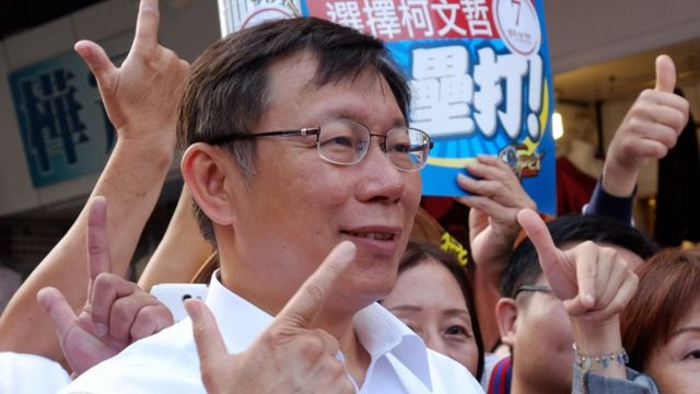 To go with Taiwan-politics-vote-mayor,FOCUS by Amber Wang In this picture taken on November 25, 2014, Ko Wen-je, an independent Taipei mayor candidate, gestures during campaigning in Taipei.