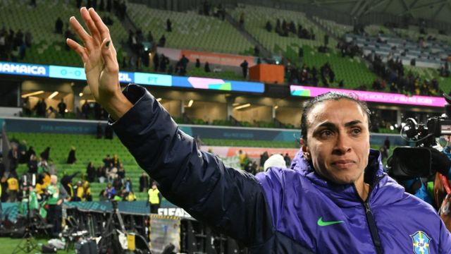 Marta looks emotional as she waves to the crowd