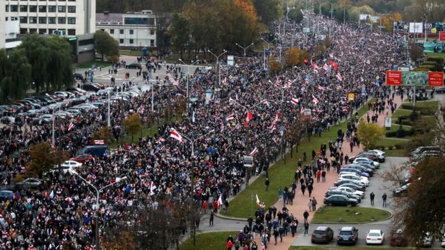 People attend an opposition rally to reject the Belarusian presidential election results in Minsk, Belarus, 25 October 2020
