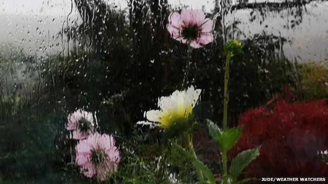 Grey, wet weather seen through a window