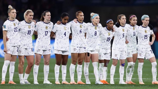 The US national team stand next to each other during a penalty shoot-out at this year's World Cup
