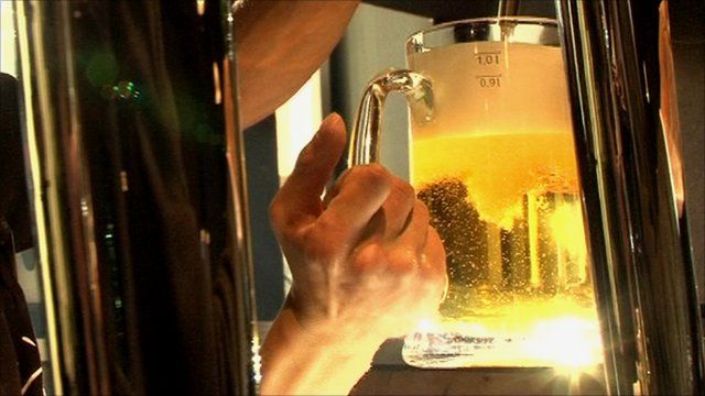 Beer being poured in bar