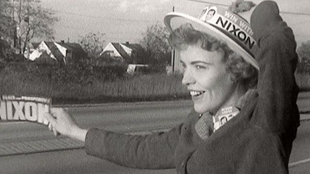 Nixon campaigner waves sign in 1960 Levittown, PA