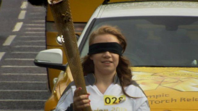 Mia Rathband carrying the Olympic torch