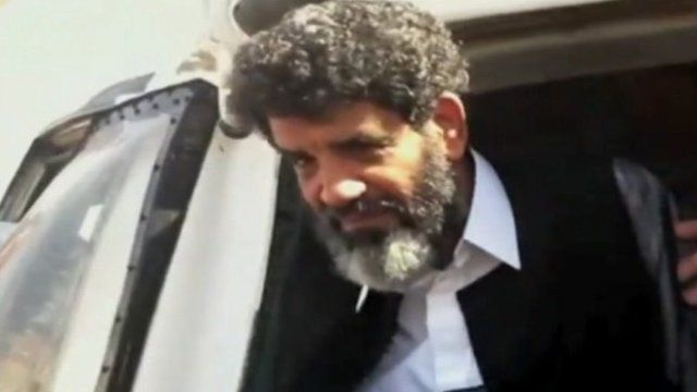 Pictures on social media appeared to show Abdullah al-Senussi stepping down from a helicopter