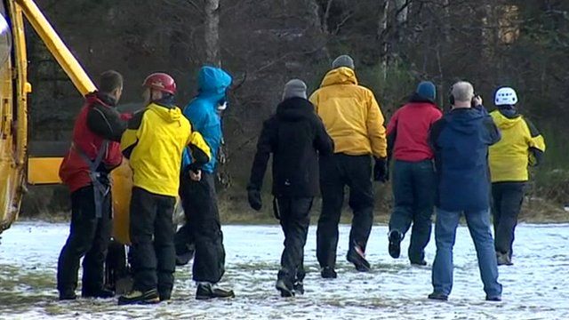 Rescued walkers leave helicopter
