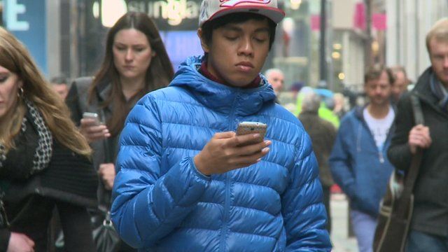 Shoppers checking phones