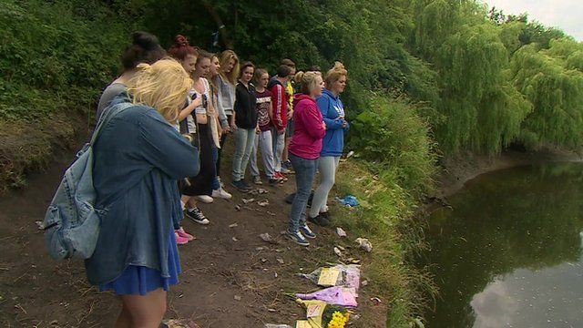 Friends of the girls at the river site where they died