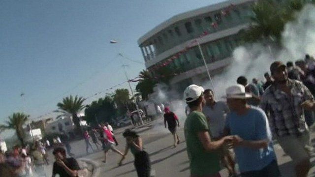 People flee tear gas in Tunis