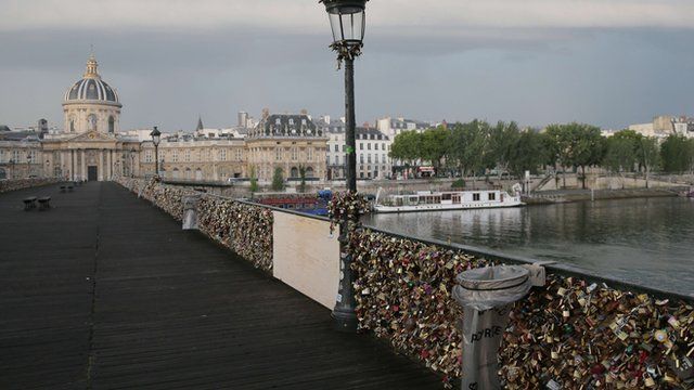 Part of Pont Des Arts footbridge in Paris boarded up.