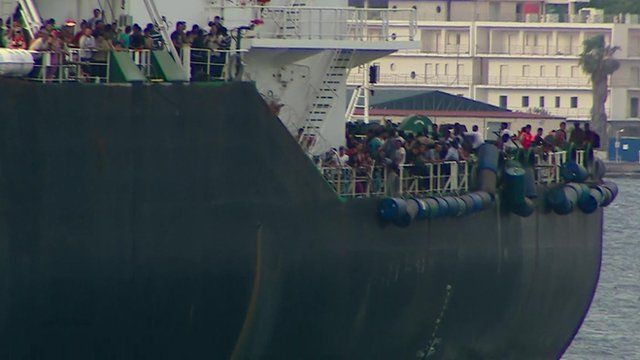Migrants on board a ship