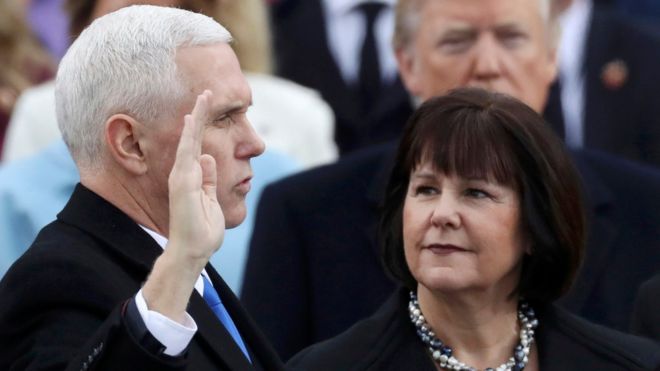 Mike Pence is sworn in as US vice president, next to his wife, Karen Pence