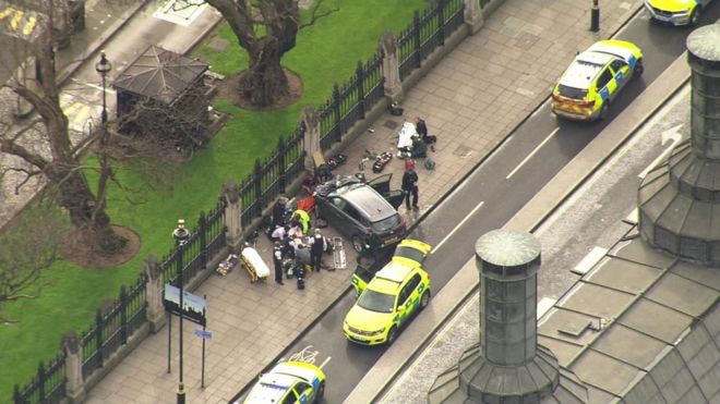 Ambulance crews and police outside the Palace of Westminster