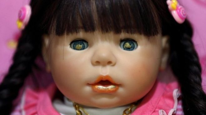 A picture made available on 25 January 2016 shows a Child Angels Dolls painted with holy gold sheets in its eyes and mouth,