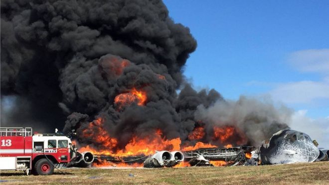 Fire engine by the burning plane in Guam