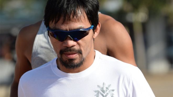 Philippine boxing great Manny Pacquiao (front) jogs along the sports complex in General Santos on the southern island of Mindanao on February 19, 2016