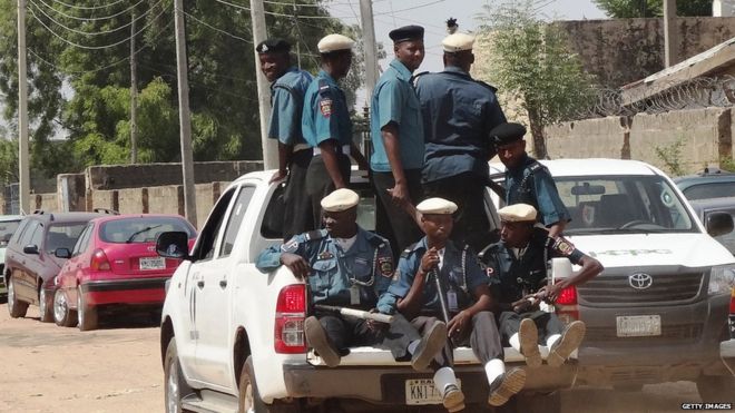 A team of Islamic sharia enforcers called Hisbah is on patrol in the northern Nigerian city of Kano in an open pickup on October 29, 2013.