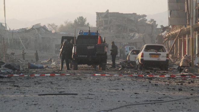Afghan security officials inspect the scene of multiple suicide bombing that targeted the German consulate in Mazar-e-Sharif, Afghanistan, 11 November 2016.