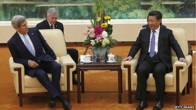 S. Secretary of State John Kerry (L) sits on a chair for the meeting with Chinese President Xi Jinping at the Great Hall of the People on May 17, 2015 in Beijing, China
