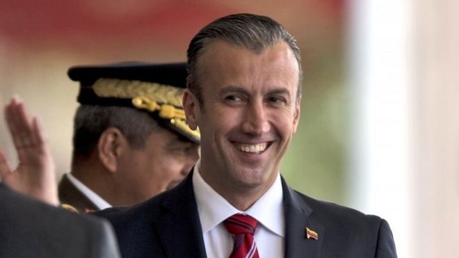 In this Feb. 1, 2017 photo, Venezuela"s Vice President Tareck El Aissami, right, is saluted by Boilivarian Army officer upon his arrival for a military parade at Fort Tiuna in Caracas, Venezuela
