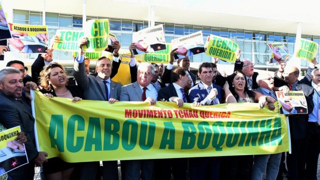 Opposition MPs hold a banner that reads "Bye Darling Movement. The source dried up" during protest in Brasilia. 12 April 2016