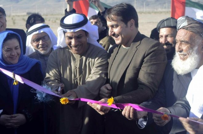 Humayoon Azizi (2-R) the Governor of Kandahar province and Abdullah Mohammed Essa Obaid Al Kaabi (3-R) a top diplomat of the United Arab Emirates (UAE) embassy in Kabul, during a ceremony in Kandahar, Afghanistan, on 10 January 2017.