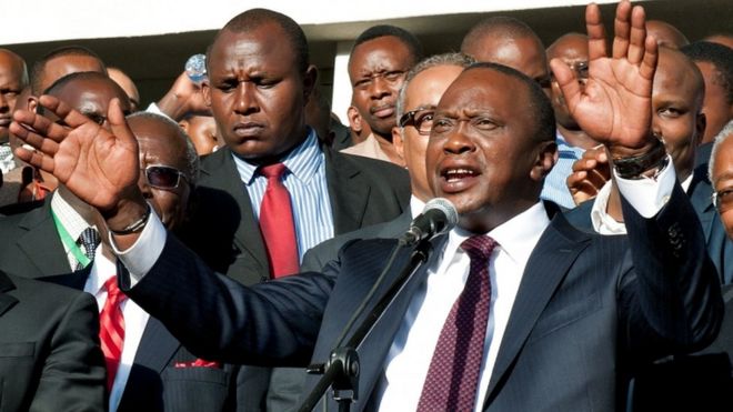 Uhuru Kenyatta [C) speaks following his victory in Kenya